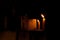 Ritual candles on the step of the sacred pagoda at night.