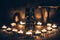 A ritual halloween witchcraft scene with candles, statue on the rustic background