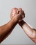 Rivalry, closeup of male arm wrestling. Muscular men measuring forces, arms. Hand wrestling, compete. Hands or arms of