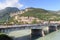 River Adige, bridge and mountain alps panorama in Trento, Italy