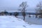 River Aiviekste in Vidzeme, Latvia in winter time. High water level in the river, dark January day. A lonely tree in the