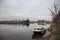 River amstel and small boat in winter not far from Amsterdam