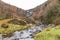 River in Autumn Fall, waterfall in distance, wide angle