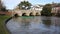 River Avon Christchurch Dorset England UK with bridge and water flowing towards the camera near to Bournemouth