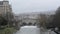 River Avon flowing through city of Bath, UK, with Puteney bridge and weir