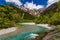 River Azusa flowing through the Kamikochi valley with snowy peaks (Kamikochi, Japan