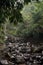 A River with Big Volcanic Material Stones