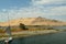 The river is the Blue Nile, Elephantine island and the fishing felucca. Aswan, Egypt