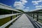 River Boardwalk under Blue Sky