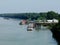 river boats and barges on the Danube at a loading area for loading