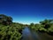 River with bright blue sky