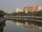 River, building, trees and reflection at Zhuhai