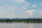 River and cirrus, cumulus clouds on blue sky background