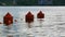 River in city landscape - stone on background. The buoy sways on the waves of the river