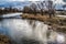 River on a cold winter day. Peaceful water in the river and on a cold gray day in the Winter countryside