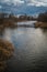 River on a cold winter day. Peaceful water in the river and on a cold gray day in the Winter countryside