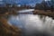 River on a cold winter day. Peaceful water in the river and on a cold gray day in the Winter countryside