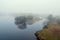 River Corrib bank in a fog. Galway city, Ireland. Cool toned. Nobody. Serene atmosphere