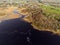River Corrib in county Galway, Menlo area. Ireland. Aerial drone view. Cloudy sky. Small fishing boat