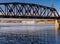 River cruise boat docked in Dubuque IA under Railroad bridge