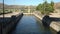 River cruise boat slowly enters the lock of the Pocinho dam on the River Douro in Portugal