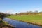 River Darwen running through farmland near Blackburn.