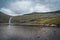 River delta with black sand beach, rocks and high cliffs in Faroe islands, close to village Saksun in Faroese island