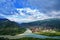 River dividing a township and mountains