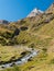 The river Dora di Rhemes flows across the valley of Rhemes; the peak called Granta Parey in the background Aosta Valley, Italy