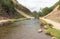 River Dove running through steep hills in Dovedale