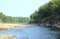 River during the dry season with looks far away fishing child