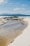 River estuary across the beach meeting the South Pacific Ocean in Marion Bay