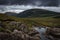 River in the Fairy Pools on the Isle of Skye under a stormy sky, Scotland, United Kingdom