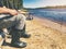 River fishing - fisherman with rod sitting on the coast