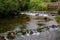 River flowing through Cheddar village in Somerset