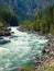 A River Flowing Through a Mountain Forest