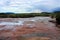 River flowing over red jasper rocks