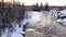 River flowing that`s starting to freeze