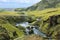 River flowing into the waterfall Skogarfoss in Iceland