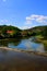 A river that flows from the mountains along a small village