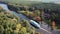 A river in the forests of Europe and a passenger ship. Autumn. Aerial view.