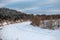 A river frozen and covered with snow