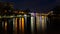 The river Fulda at night in the middle of the illuminated city of Kassel.