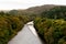 River Garry and scenic fall forest in Scotland.