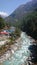 River at George Chalet by the way to Mount Everest surrounded by green trees within a vally