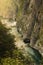 A river in a gorge with a turbulent current, cliffs turned against the water, wildlife and travel