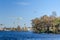 River Havel, the Island Eiswerder, tower cranes from a newly erected district and a plane heading the airport Berlin-Tegel