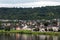 River, houses, forest and sky.