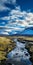 River In Iceland: A Sky-blue And Gold Landscape