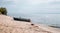 River landscape. Fishing boat on a deserted river bank